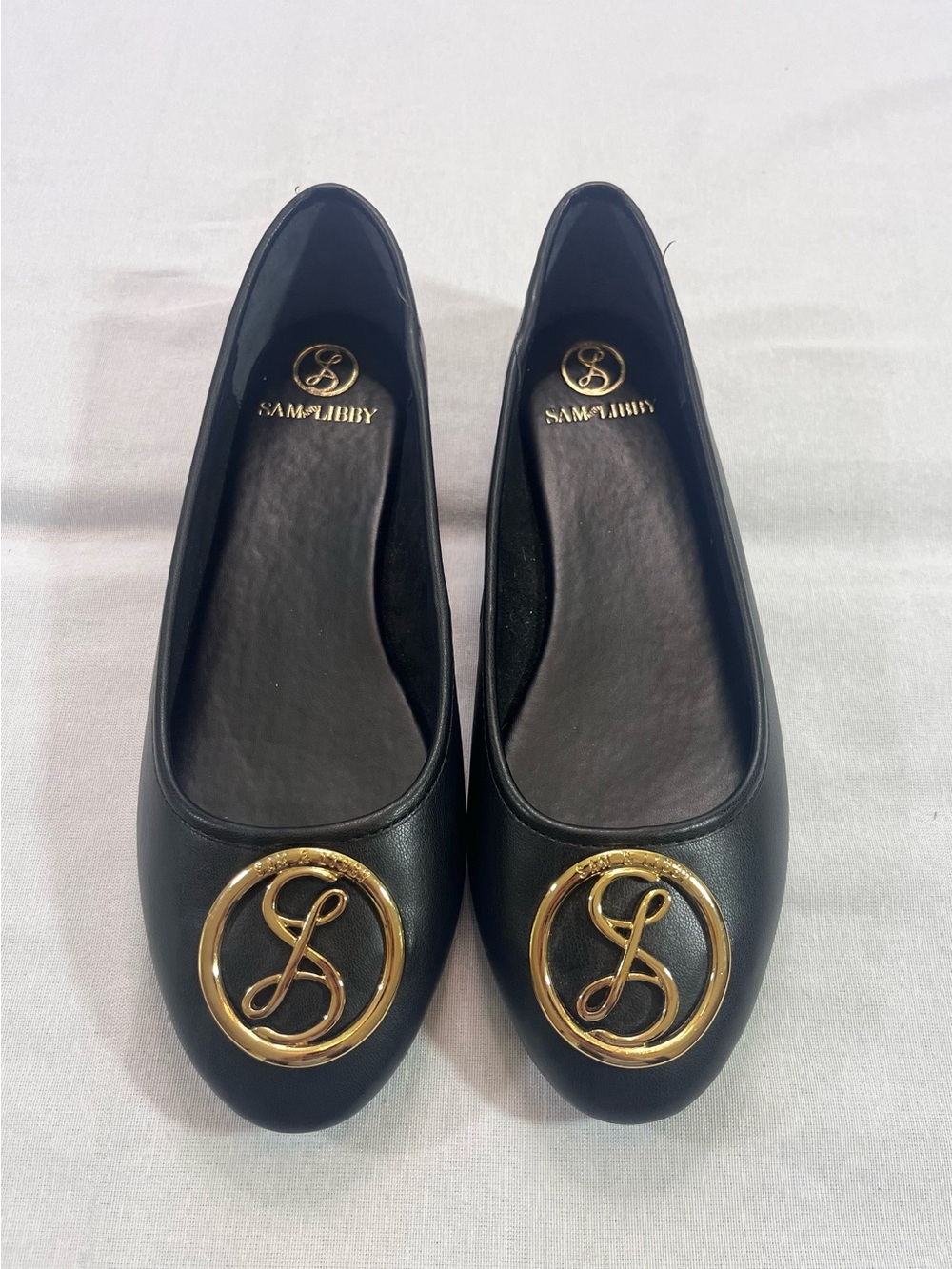 Sam & Libby Black Ballet Flats with Gold Logo Medallion